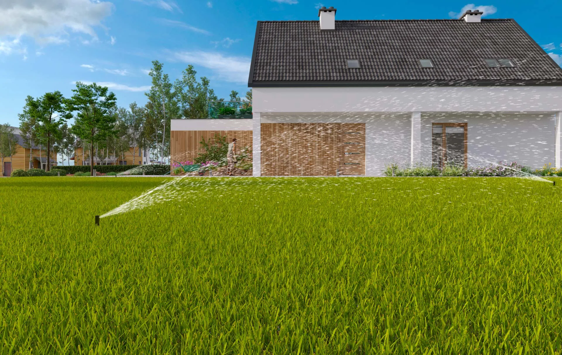 Irrigatori pop-up che bagnano il prato di un giardino